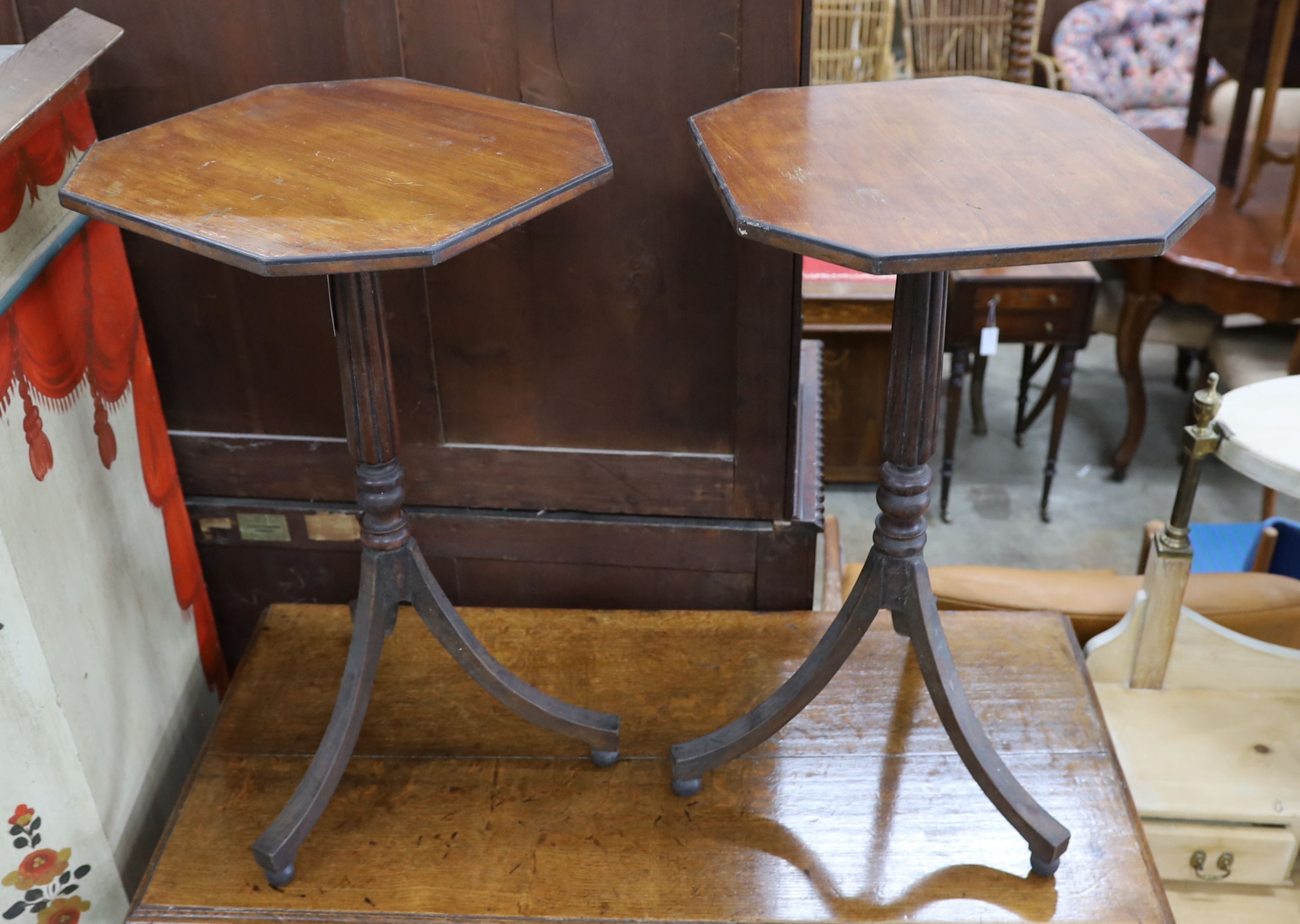A pair of Regency style octagonal tripod wine tables, width 44cm, depth 39cm, height 73cm
